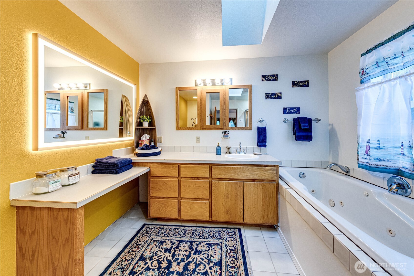 73 Ross Lane Port Angeles, WA 98363 - Photo 24 of 40 a bathroom with a bathtub sink and mirror