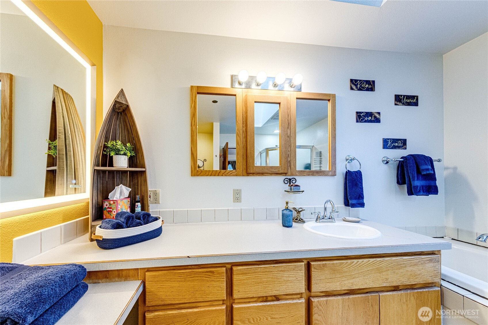 73 Ross Lane Port Angeles, WA 98363 - Photo 25 of 40 a bathroom with a sink and a mirror