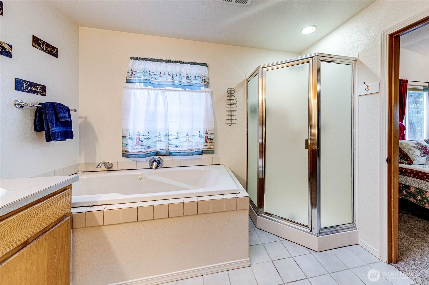 73 Ross Lane Port Angeles, WA 98363 - Photo 26 of 40 a bathroom with a bathtub and a shower