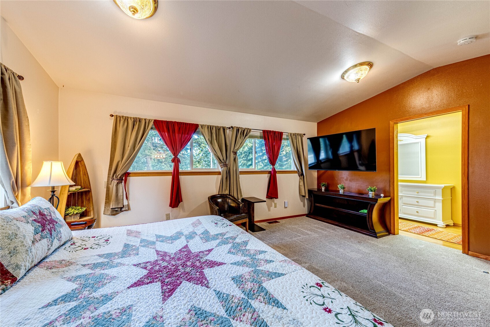 73 Ross Lane Port Angeles, WA 98363 - Photo 27 of 40 a bedroom with a bed and a flat screen television