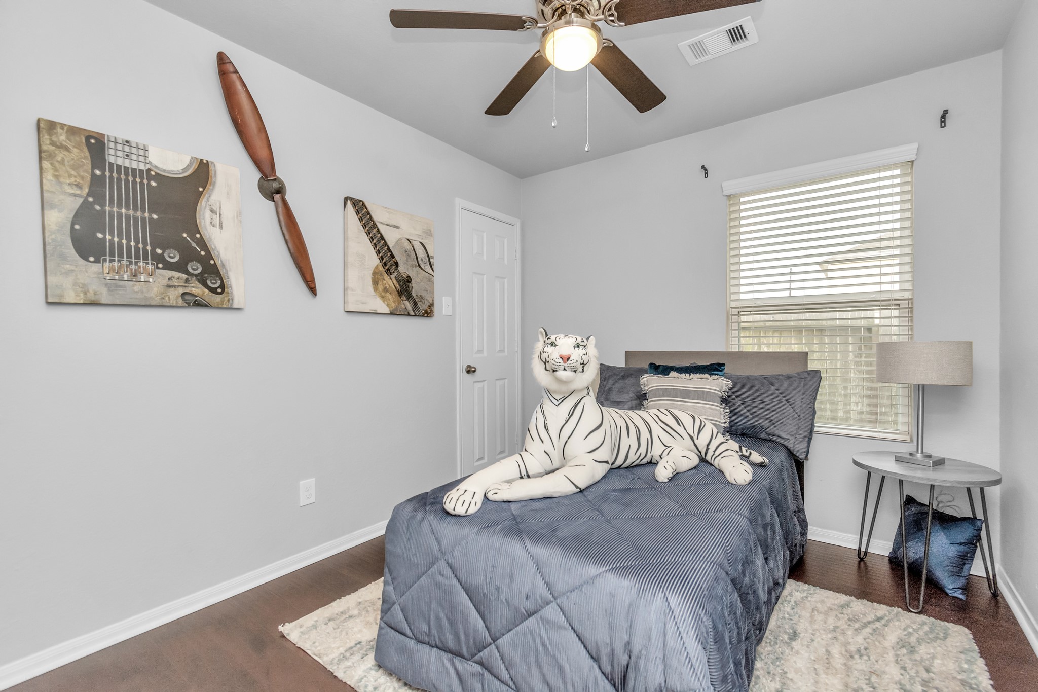 2411 Zephyr Lane Rosenberg, TX 77471 - Photo 19 of 20 a bedroom with a bed and wooden floor
