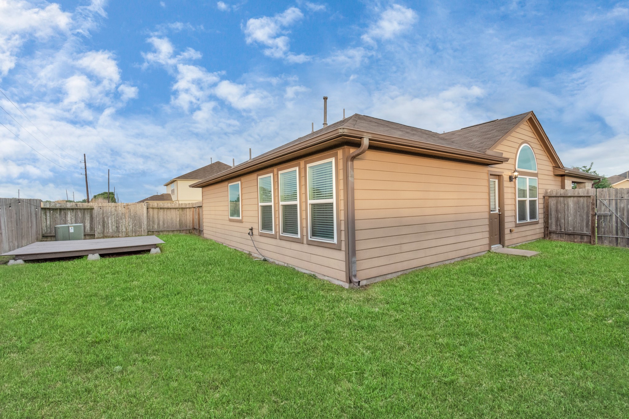 2411 Zephyr Lane Rosenberg, TX 77471 - Photo 2 of 20 a view of a backyard with a garden