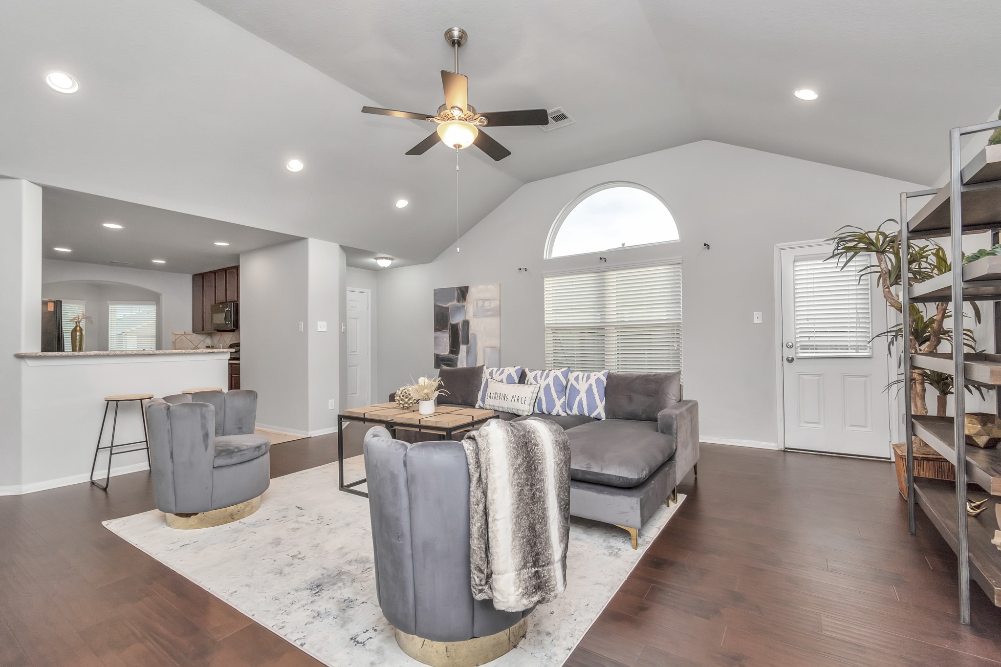 2411 Zephyr Lane Rosenberg, TX 77471 - Photo 5 of 20 a living room with furniture a fireplace and a chandelier