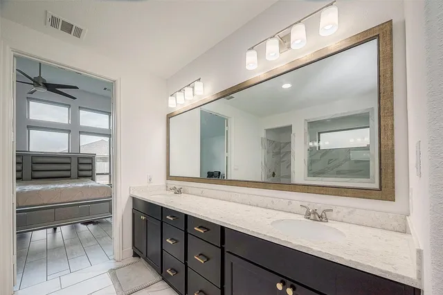 a bathroom with a sink double vanity and a mirror