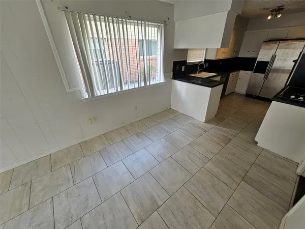 a view of a kitchen with windows