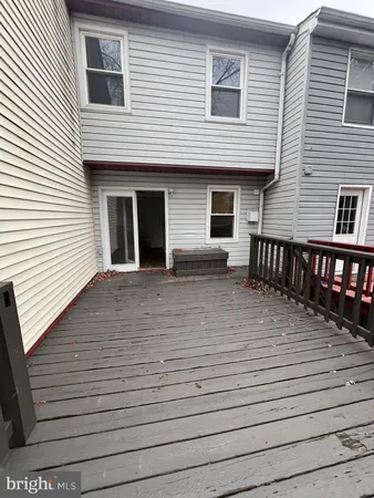 a view of a house with wooden deck