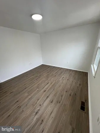 wooden floor in a hall with an entryway
