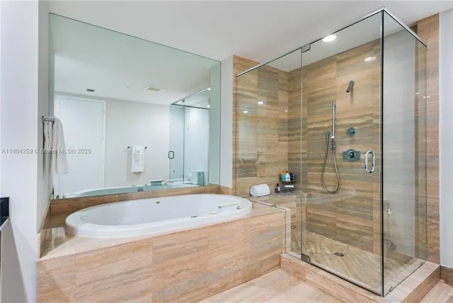 a bathroom with a bathtub and a shower
