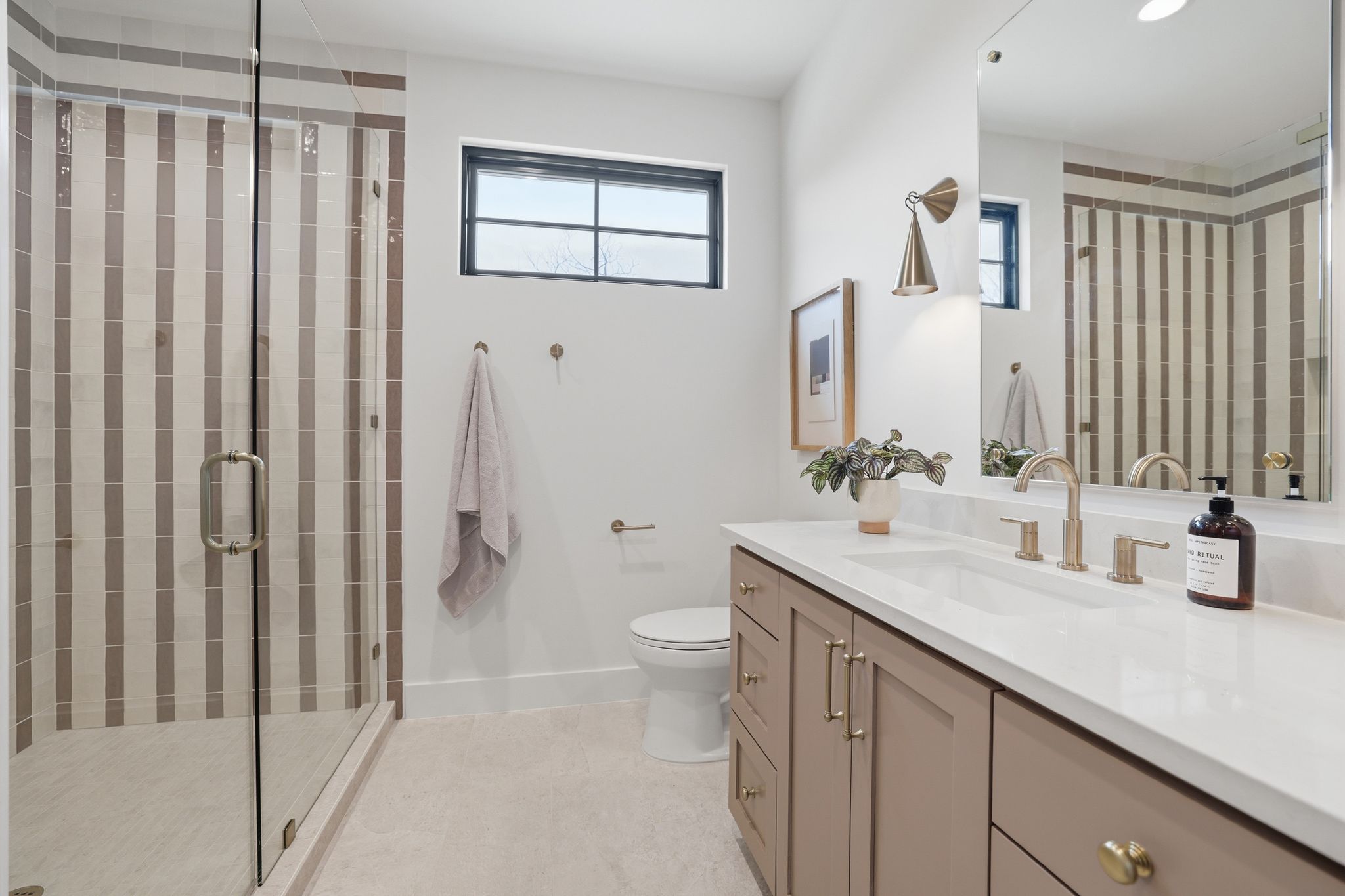 4500 Jinx Avenue Austin, TX 78745 - Photo 32 of 40 Full bathroom featuring vanity, a stall shower, and light tile patterned flooring