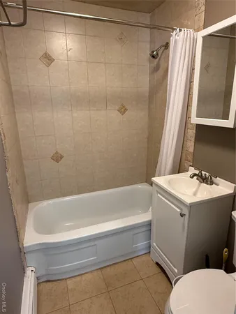 a bathroom with a sink a toilet and a bathtub