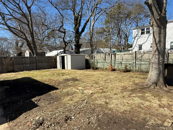 a view of yard covered with snow in front of house