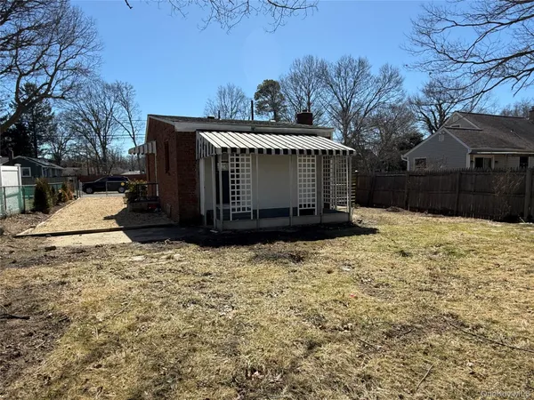 a view of a backyard of the house