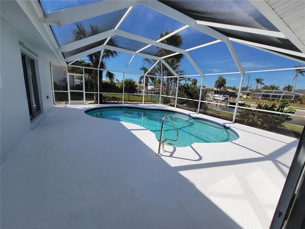 1732 Boca Raton Court Punta Gorda, FL 33950 - Photo 20 of 64 a view of a swimming pool with a patio