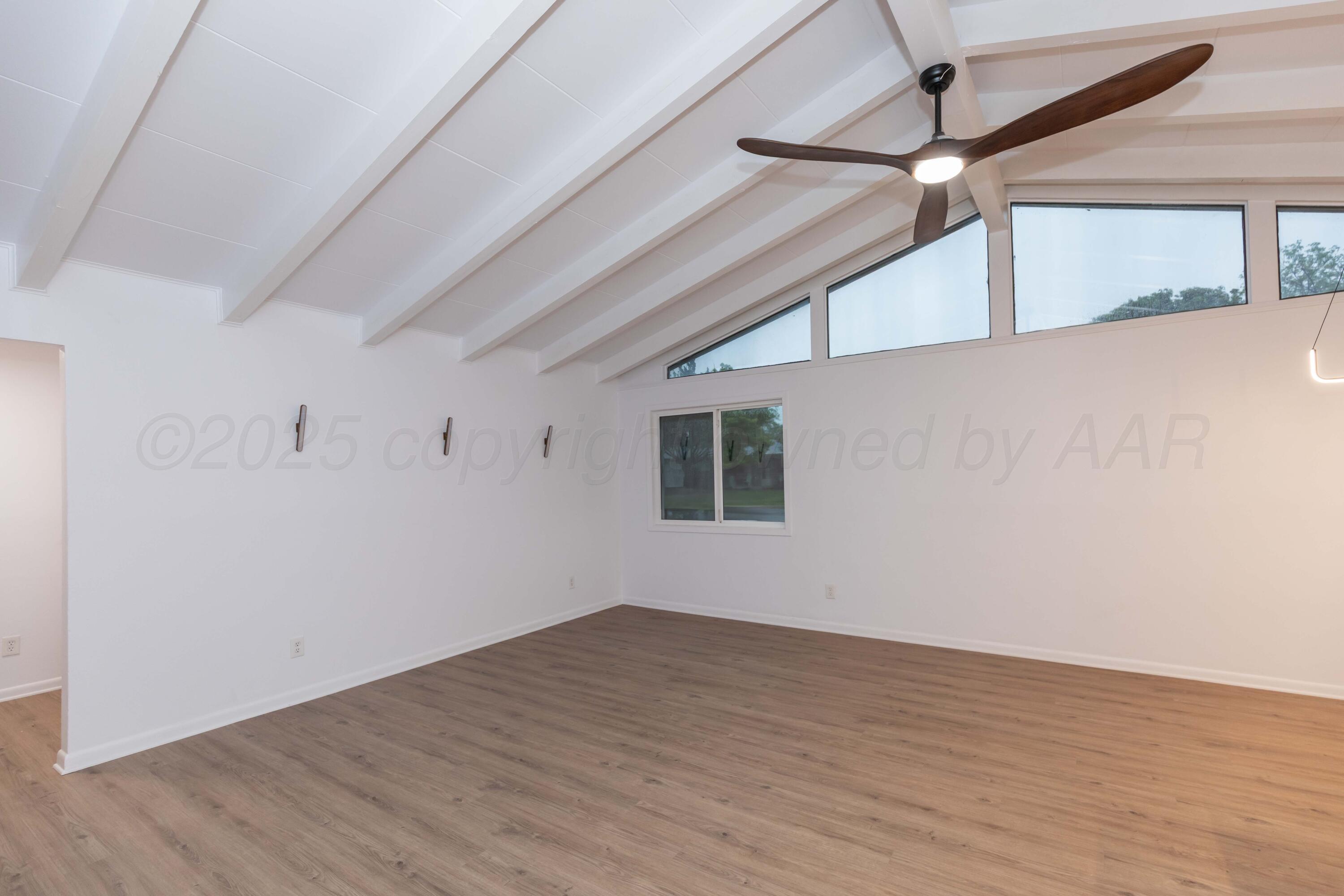 4708 South Lamar Street Amarillo, TX 79110 - Photo 11 of 40 a view of empty room with wooden floor