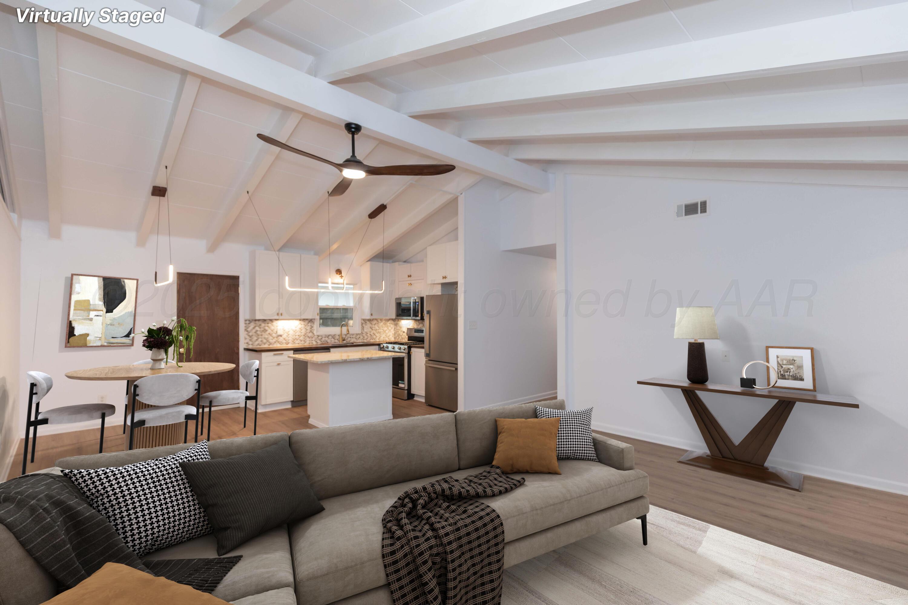 4708 South Lamar Street Amarillo, TX 79110 - Photo 12 of 40 a living room with furniture and a wooden floor