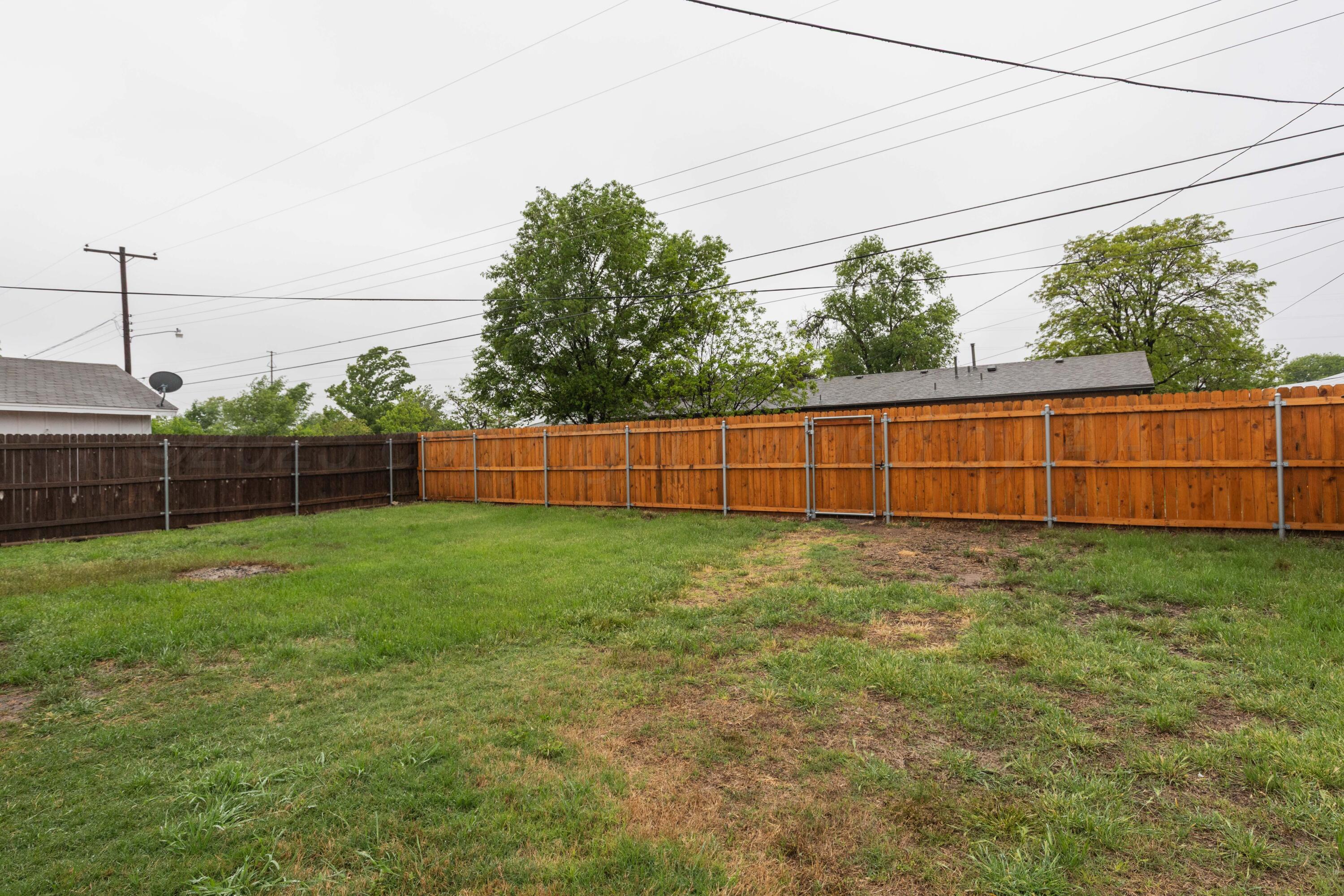4708 South Lamar Street Amarillo, TX 79110 - Photo 39 of 40 a view of backyard with wooden fence