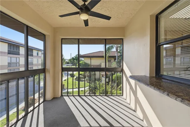 a view of a balcony with wooden floor