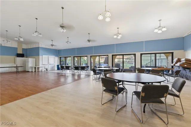 a dining room with furniture and wooden floor