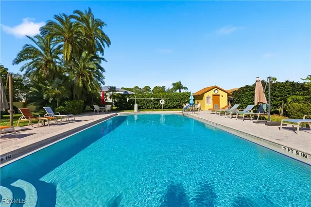 a view of swimming pool from a balcony