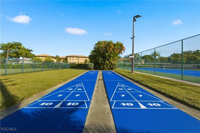 a view of a large swimming pool with a lake view