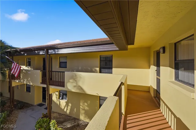 a roof deck with table and chairs