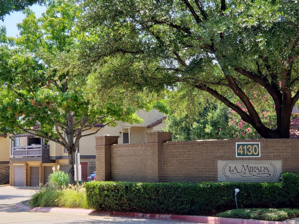 4130 Proton Drive, Unit 6A Addison, TX 75001 - Photo 1 of 1 a sign that is on a pole on a street