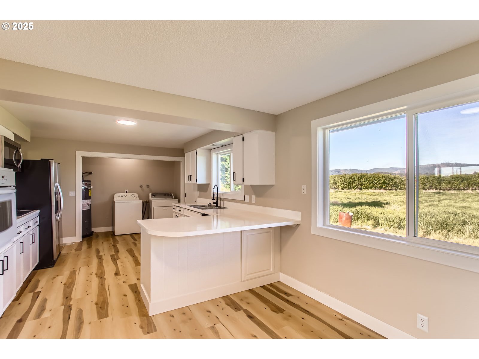 3131 Highway 47 Forest Grove, OR 97116 - Photo 12 of 30 a living room with a sink furniture and a flat screen tv