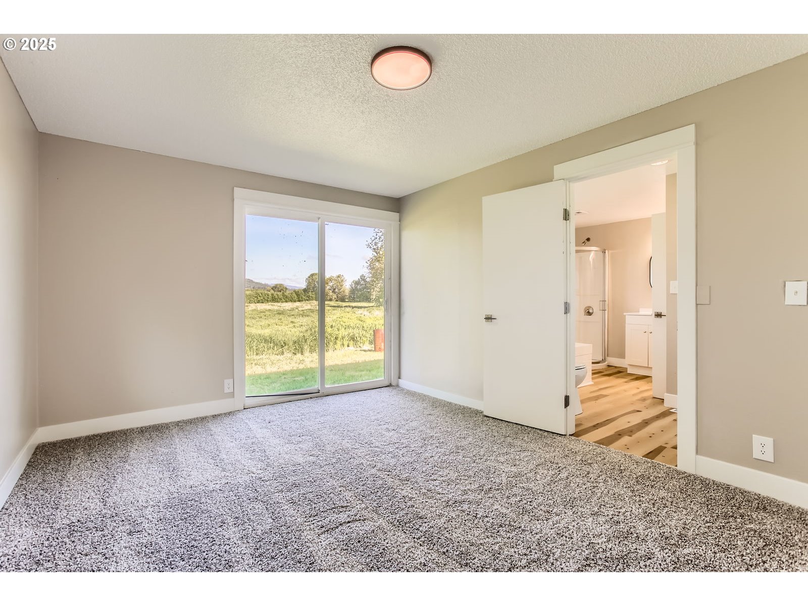 3131 Highway 47 Forest Grove, OR 97116 - Photo 17 of 30 a view of an empty room with wooden floor and a window