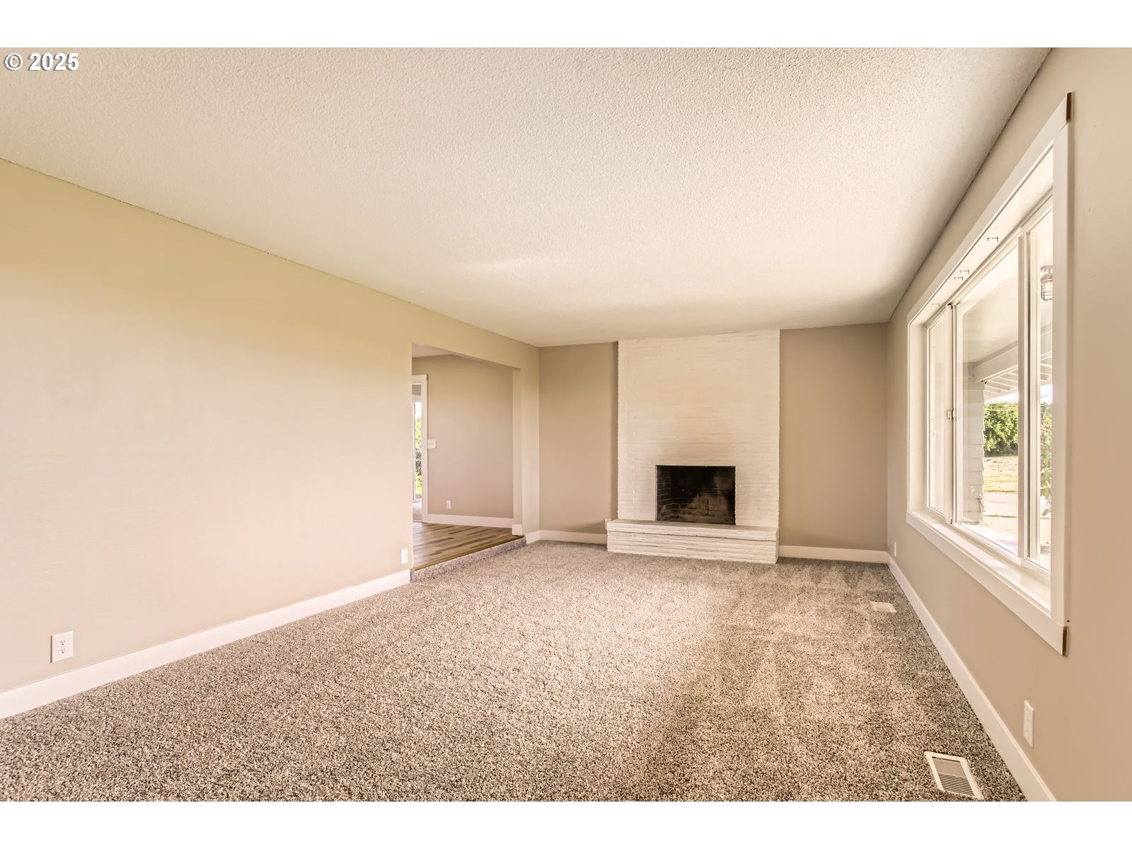 3131 Highway 47 Forest Grove, OR 97116 - Photo 6 of 30 a view of an empty room with a window and a fireplace