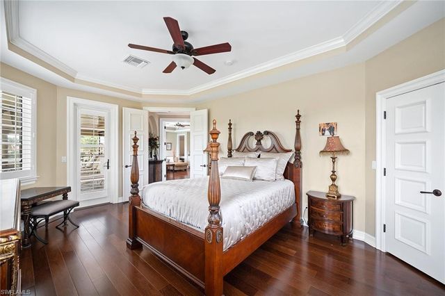a bed room with a bed and wooden floor