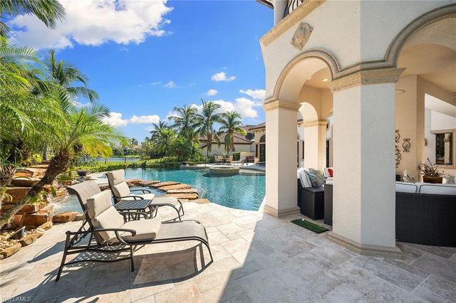 a view of a swimming pool with a lounge chairs