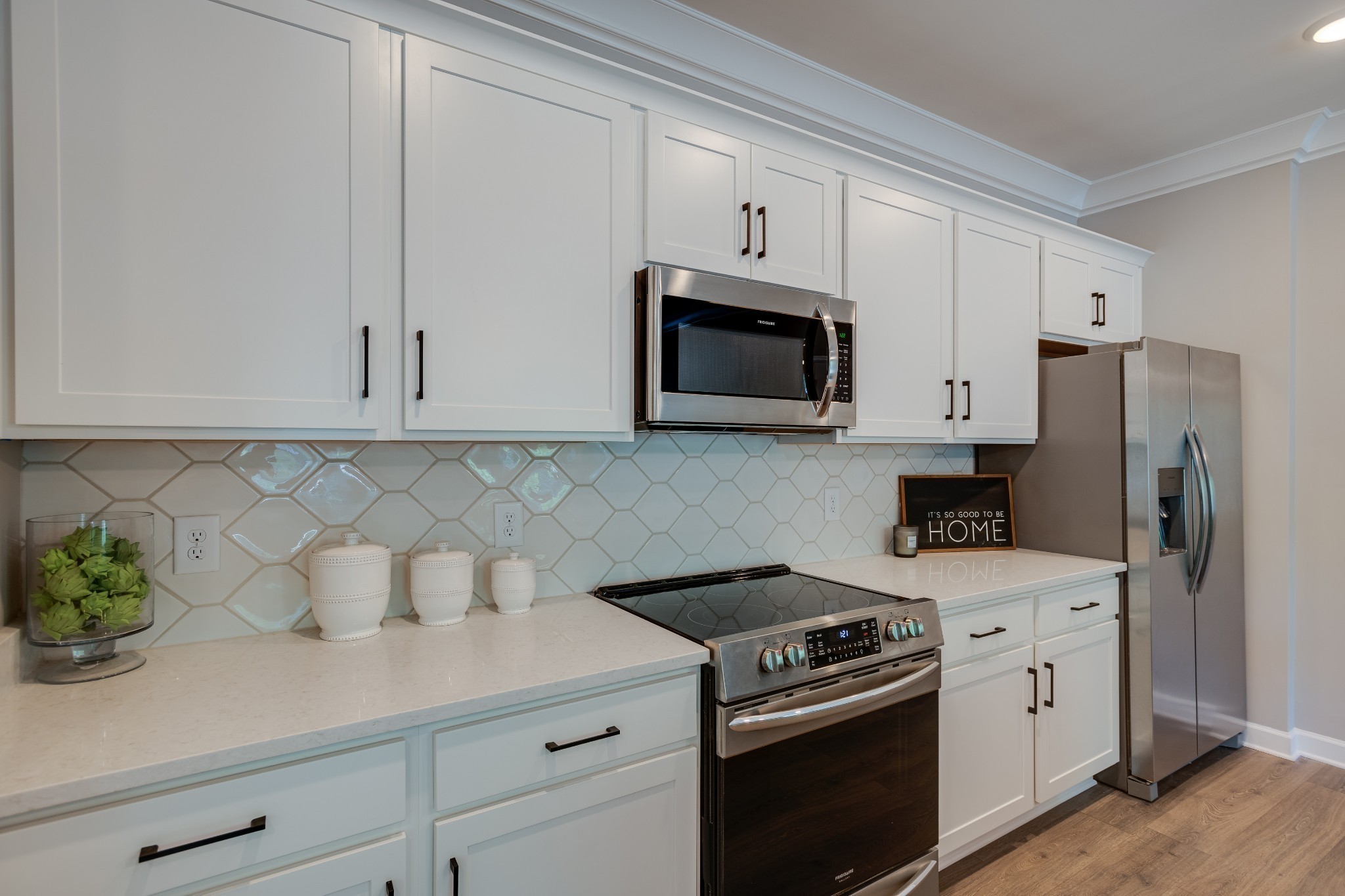 1711 Fenway Loop Antioch, TN 37013 - Photo 16 of 29 a kitchen with stainless steel appliances white cabinets and a stove a oven with white countertops