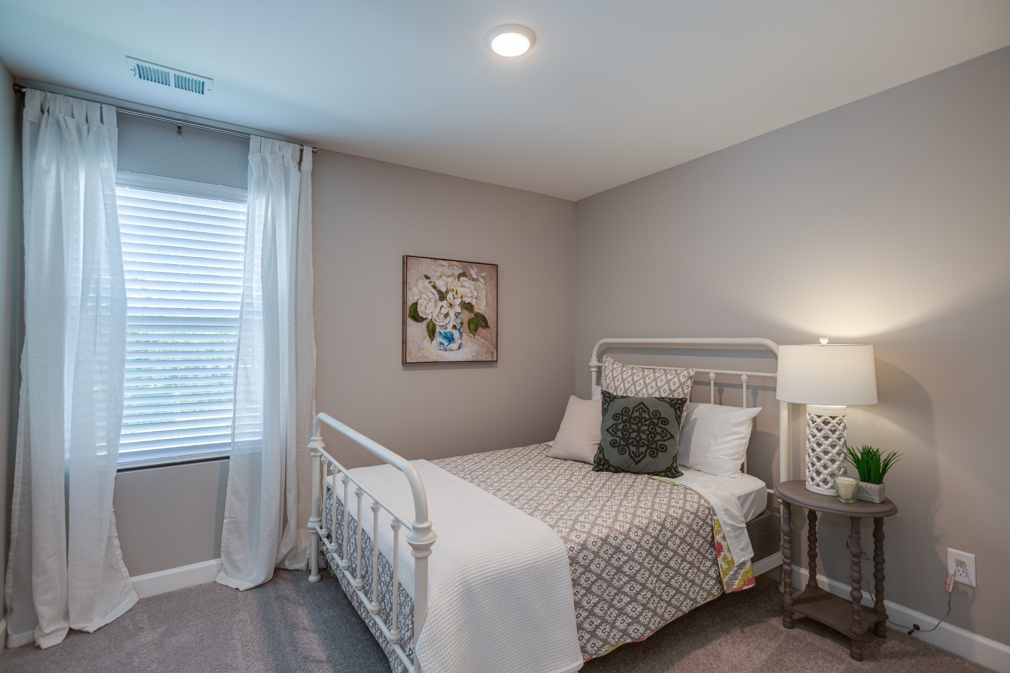 1711 Fenway Loop Antioch, TN 37013 - Photo 18 of 29 a bedroom with a bed and a window