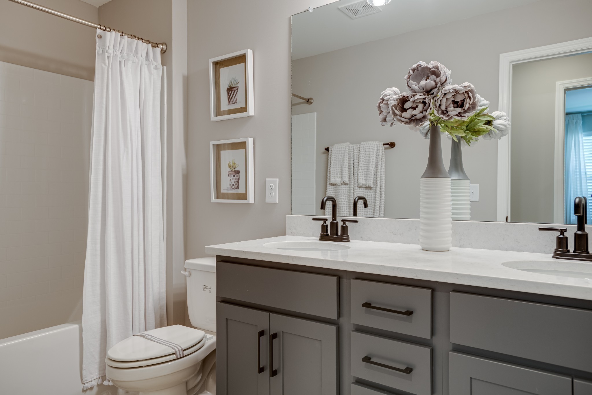 1711 Fenway Loop Antioch, TN 37013 - Photo 24 of 29 a bathroom with a sink a toilet and a mirror