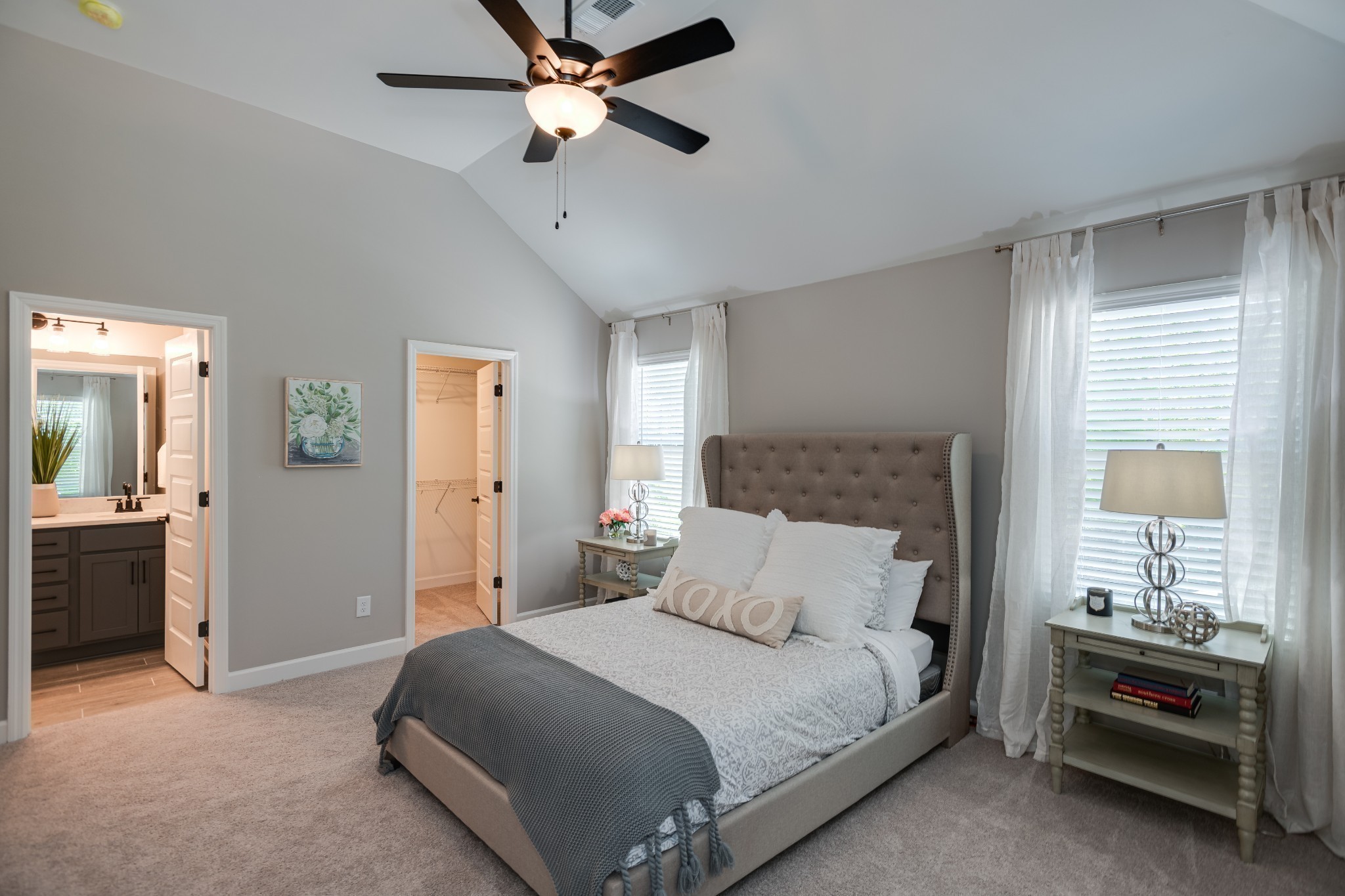 1711 Fenway Loop Antioch, TN 37013 - Photo 27 of 29 a bedroom with a bed and a chandelier