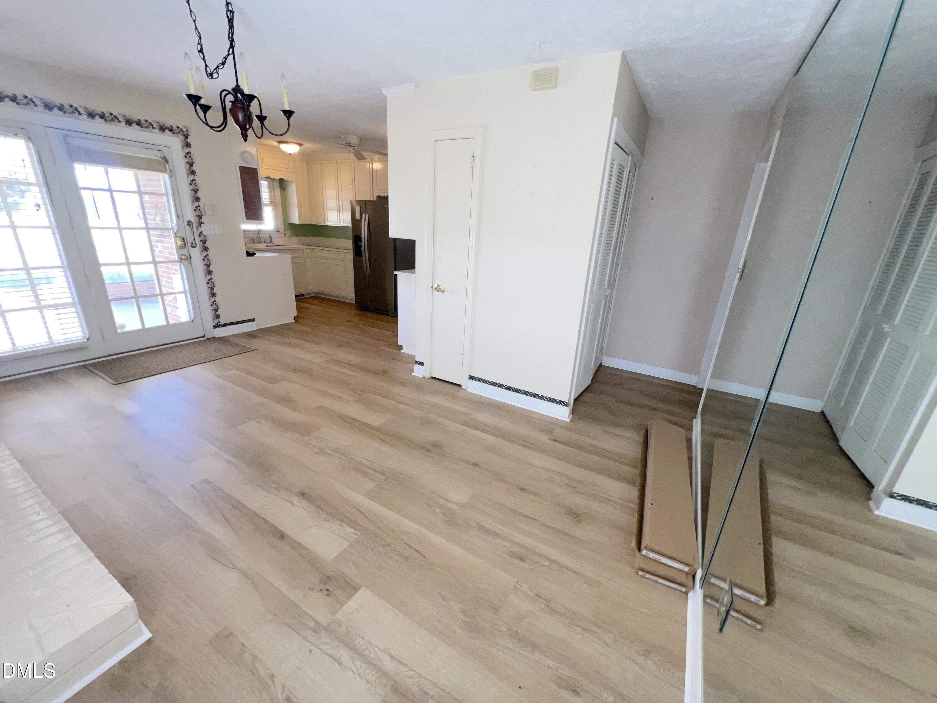66 Allensville Road Roxboro, NC 27573 - Photo 10 of 52 a view of a hallway with wooden floor and staircase