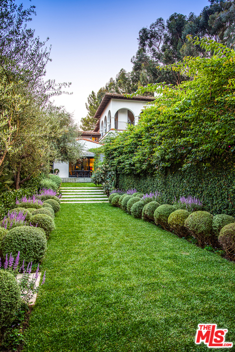 609 East Channel Road Santa Monica, CA 90402 - Photo 30 of 31 a view of a house with a backyard and garden