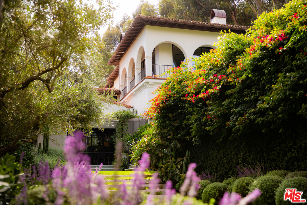 609 East Channel Road Santa Monica, CA 90402 - Photo 4 of 31 a front view of a house with a yard and fountain