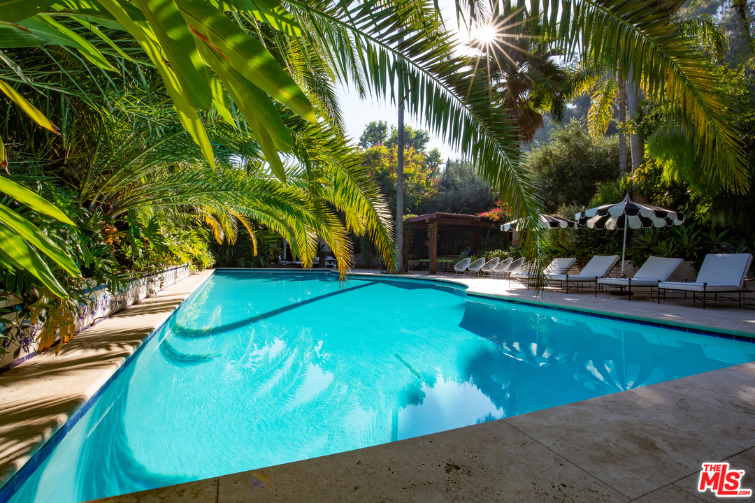 609 East Channel Road Santa Monica, CA 90402 - Photo 10 of 31 a view of a swimming pool with a garden