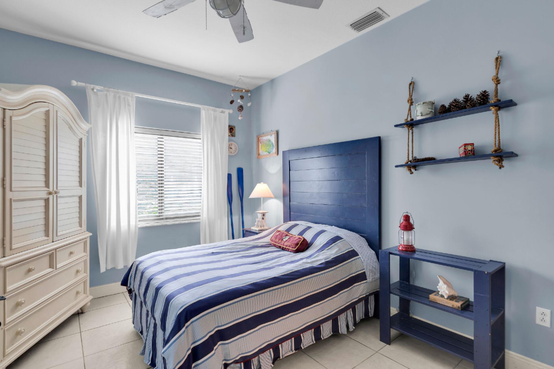 6 Fishermans Trail Key Largo, FL 33037 - Photo 20 of 41 a bedroom with a bed and a window