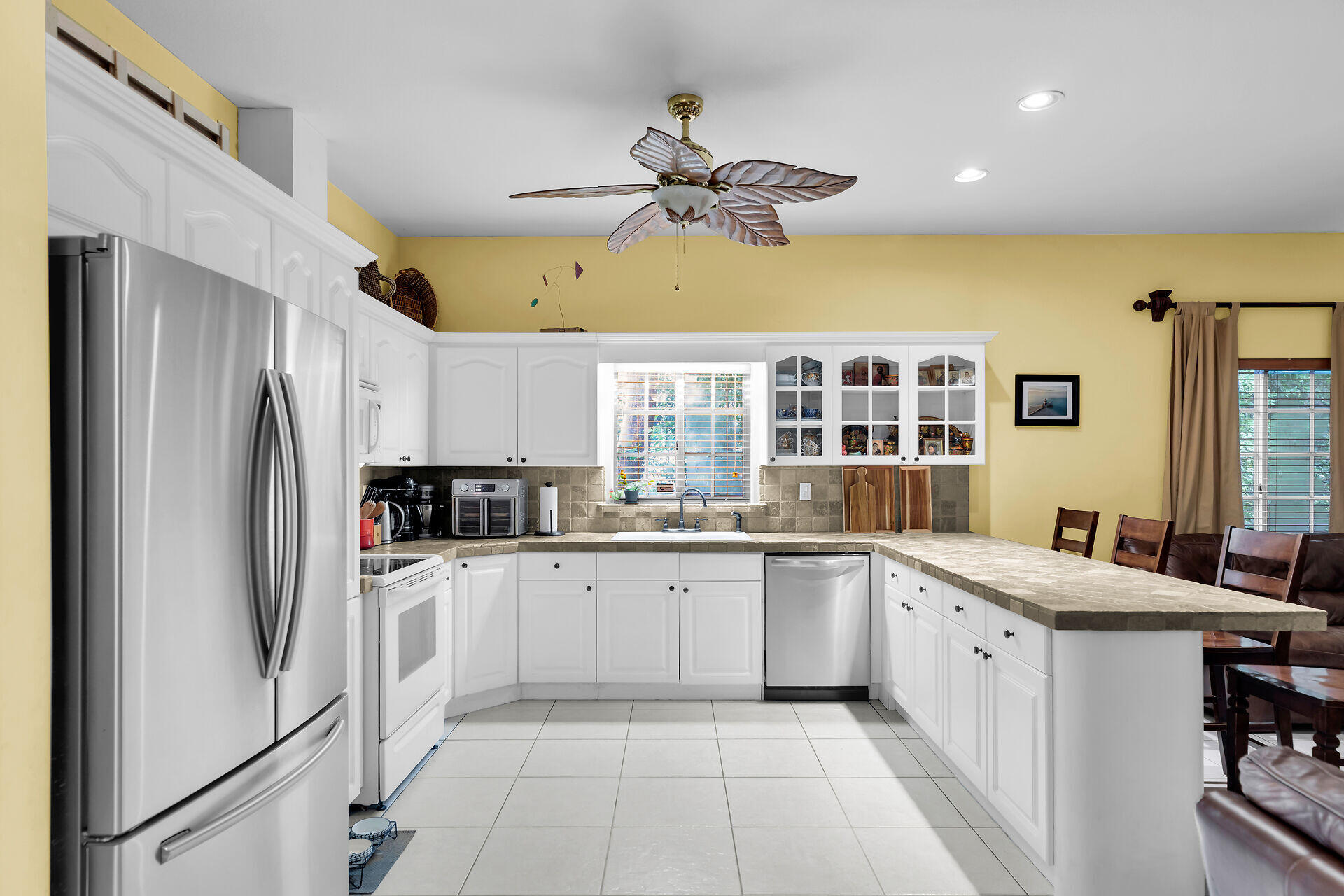 6 Fishermans Trail Key Largo, FL 33037 - Photo 2 of 41 a kitchen with a sink refrigerator and cabinets