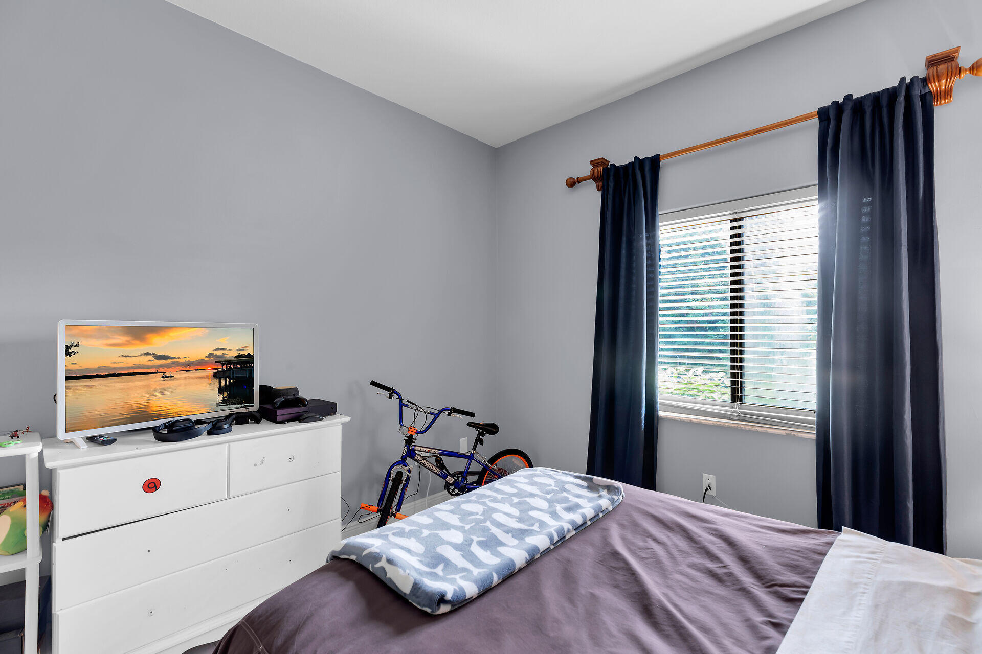 6 Fishermans Trail Key Largo, FL 33037 - Photo 24 of 41 a bedroom with a bed and flat screen tv