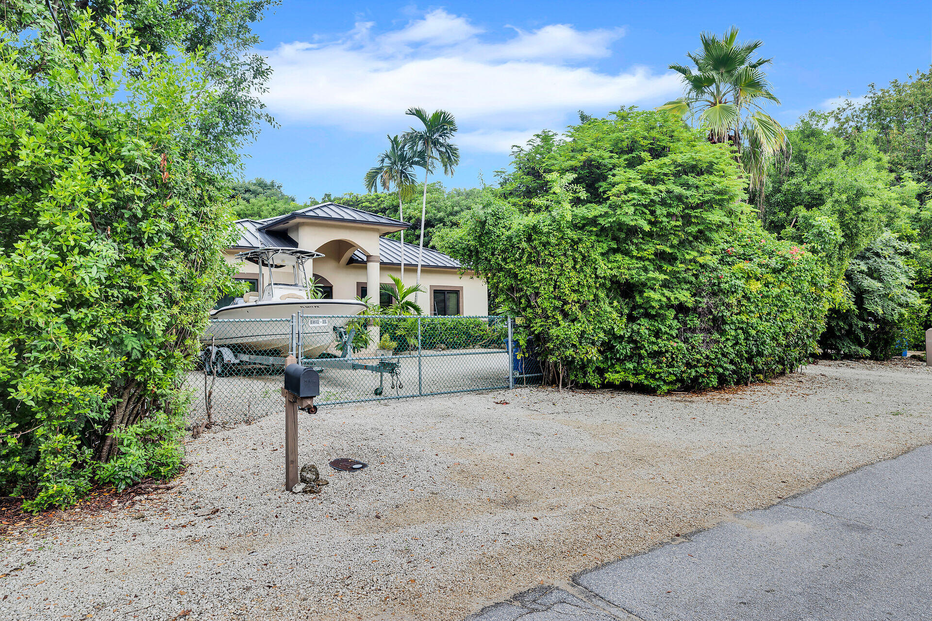6 Fishermans Trail Key Largo, FL 33037 - Photo 32 of 41 a house view with a garden space