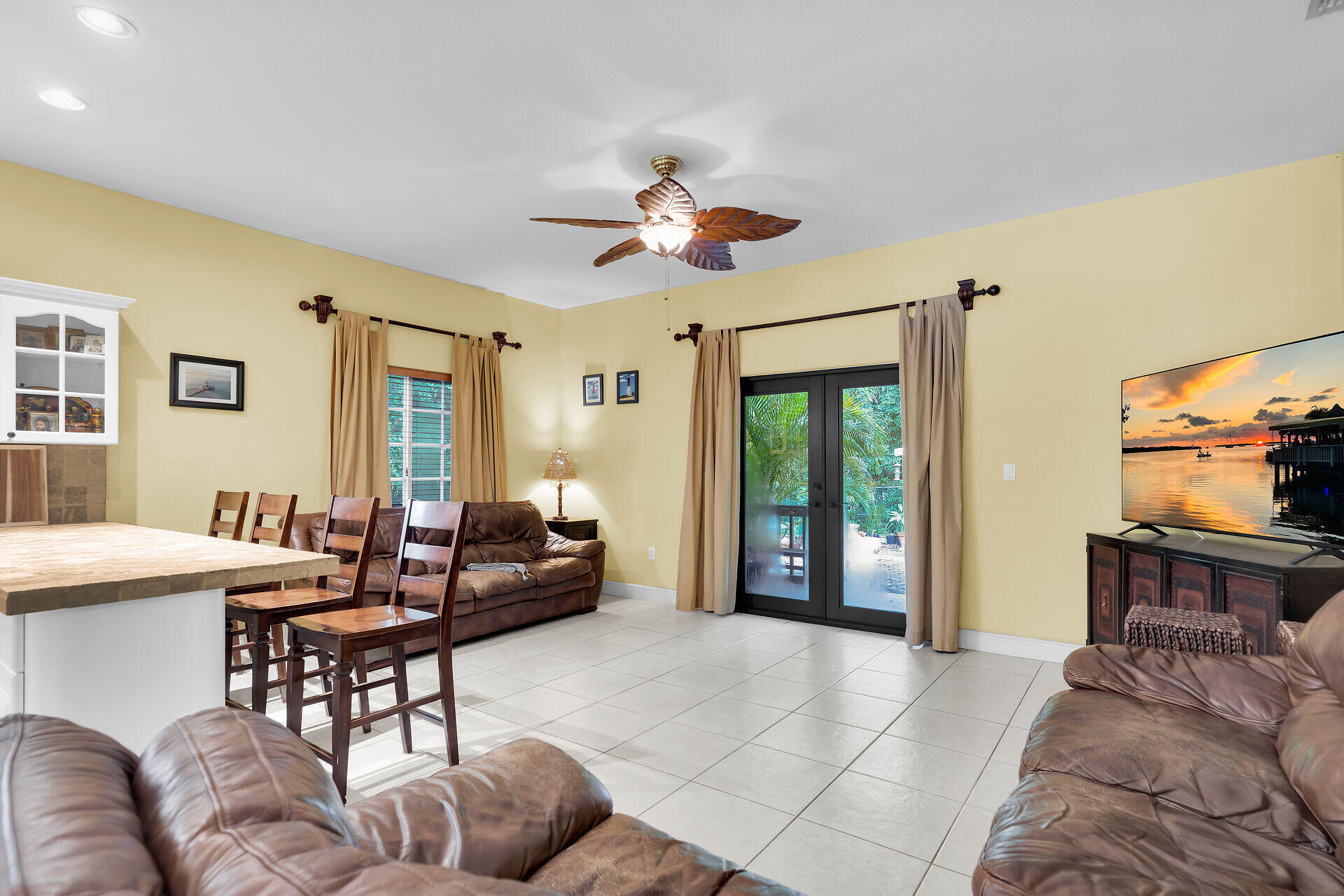 6 Fishermans Trail Key Largo, FL 33037 - Photo 9 of 41 a living room with furniture a ceiling fan and a window