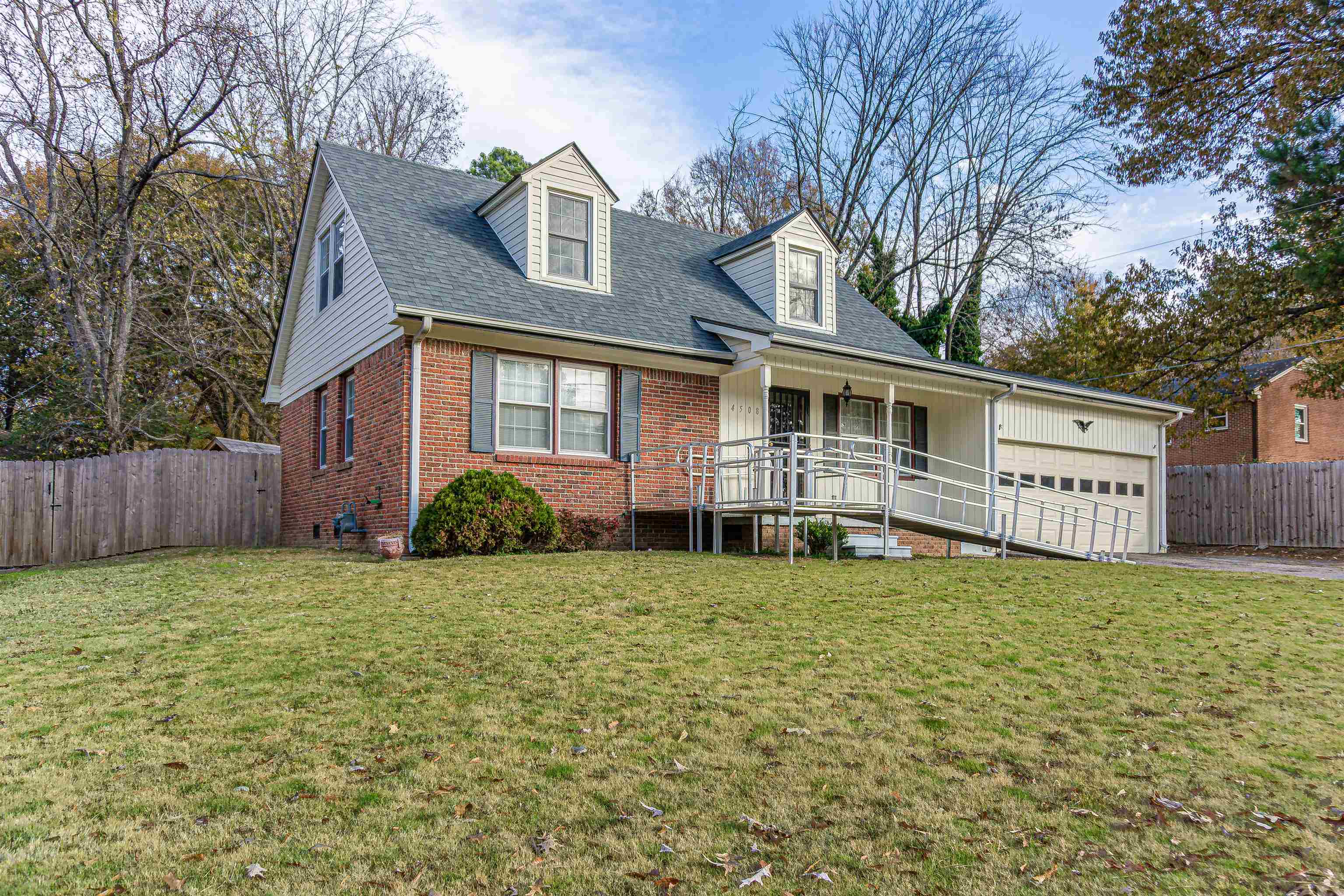4508 Yale Road Memphis, TN 38128 - Photo 2 of 19 a house that has a big yard with wooden fence