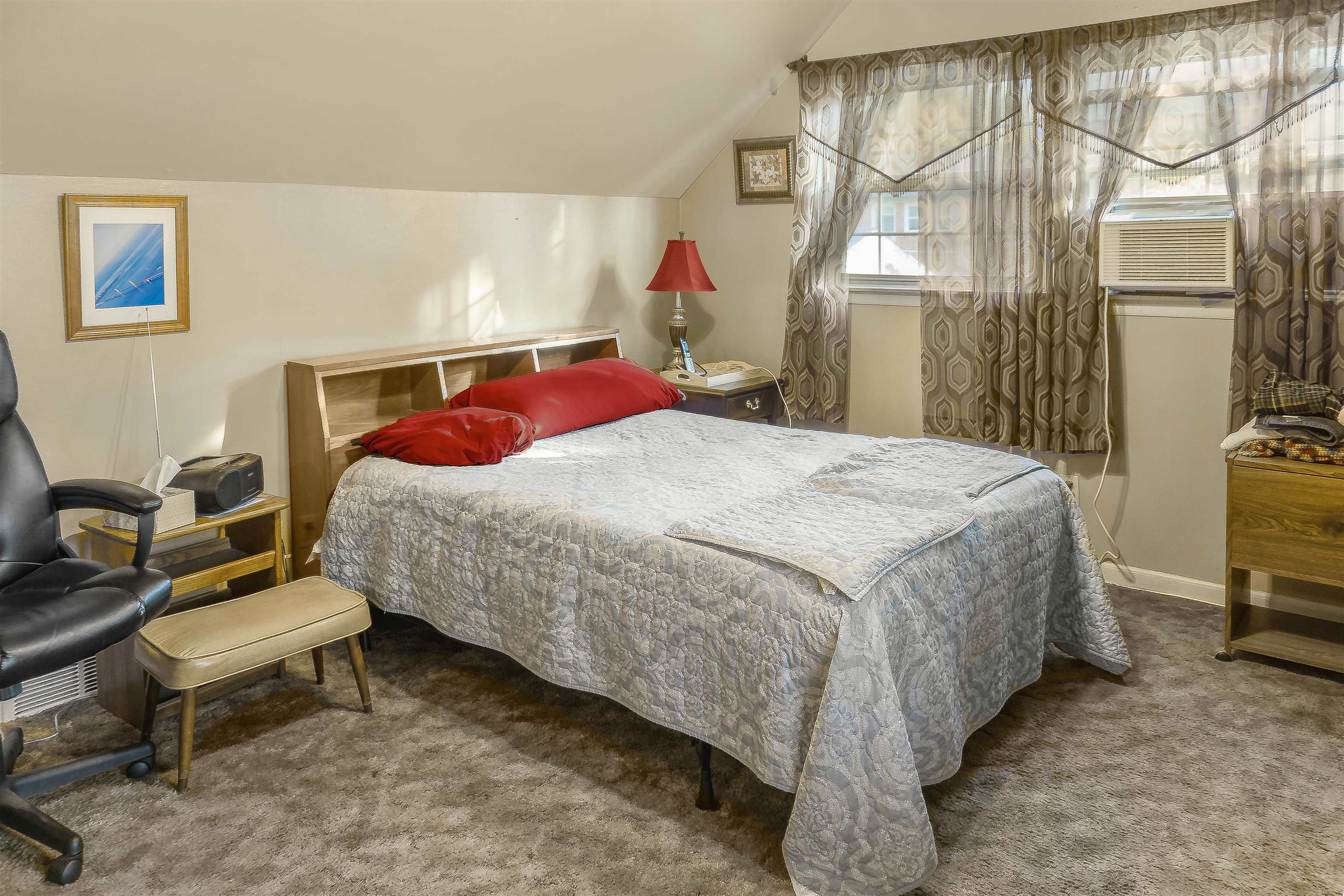 4508 Yale Road Memphis, TN 38128 - Photo 12 of 19 a bedroom with a bed and a chandelier