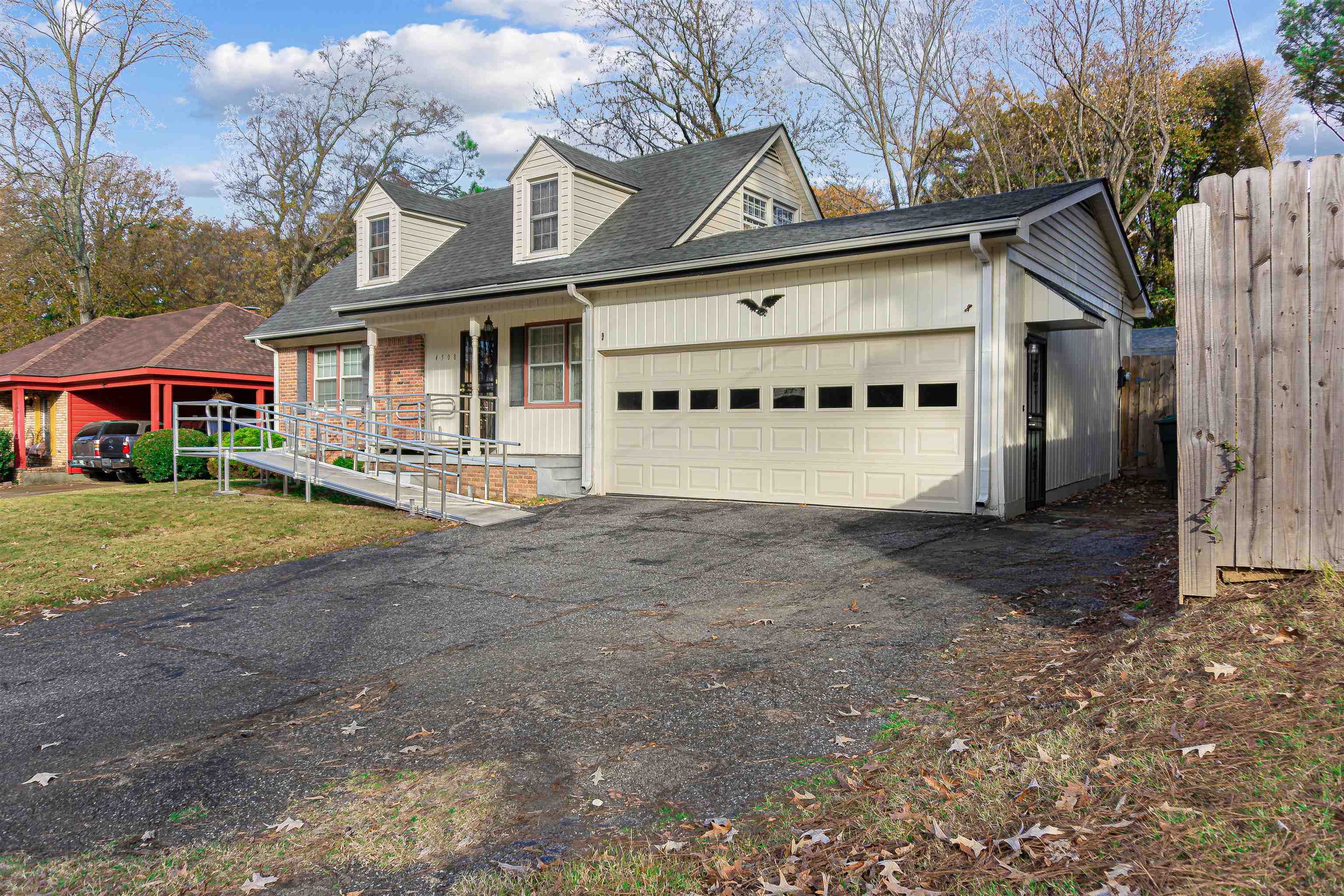 4508 Yale Road Memphis, TN 38128 - Photo 3 of 19 a front view of a house with a yard and garage