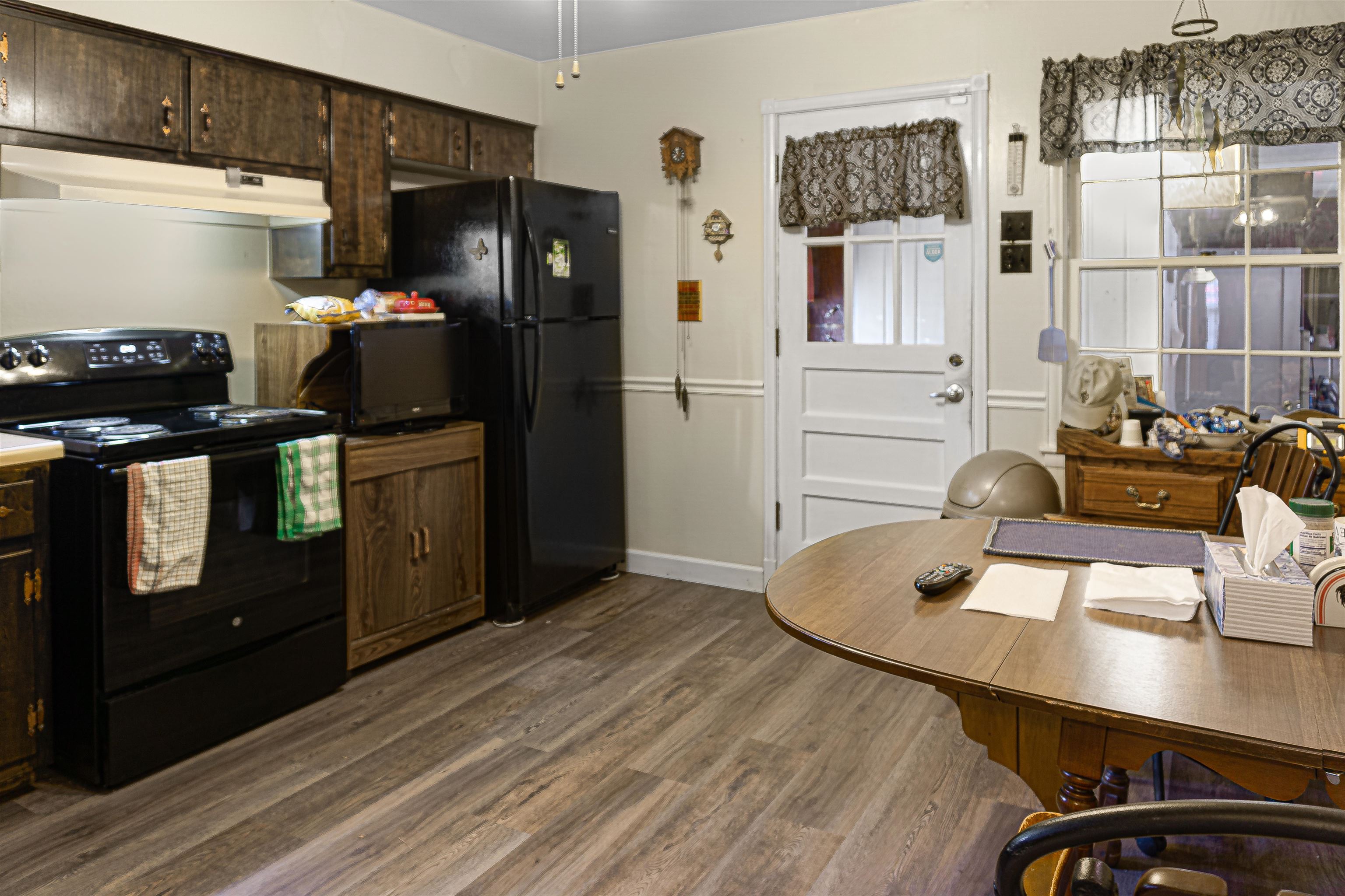 4508 Yale Road Memphis, TN 38128 - Photo 6 of 19 a kitchen with stainless steel appliances kitchen island granite countertop a refrigerator a stove and a wooden floors