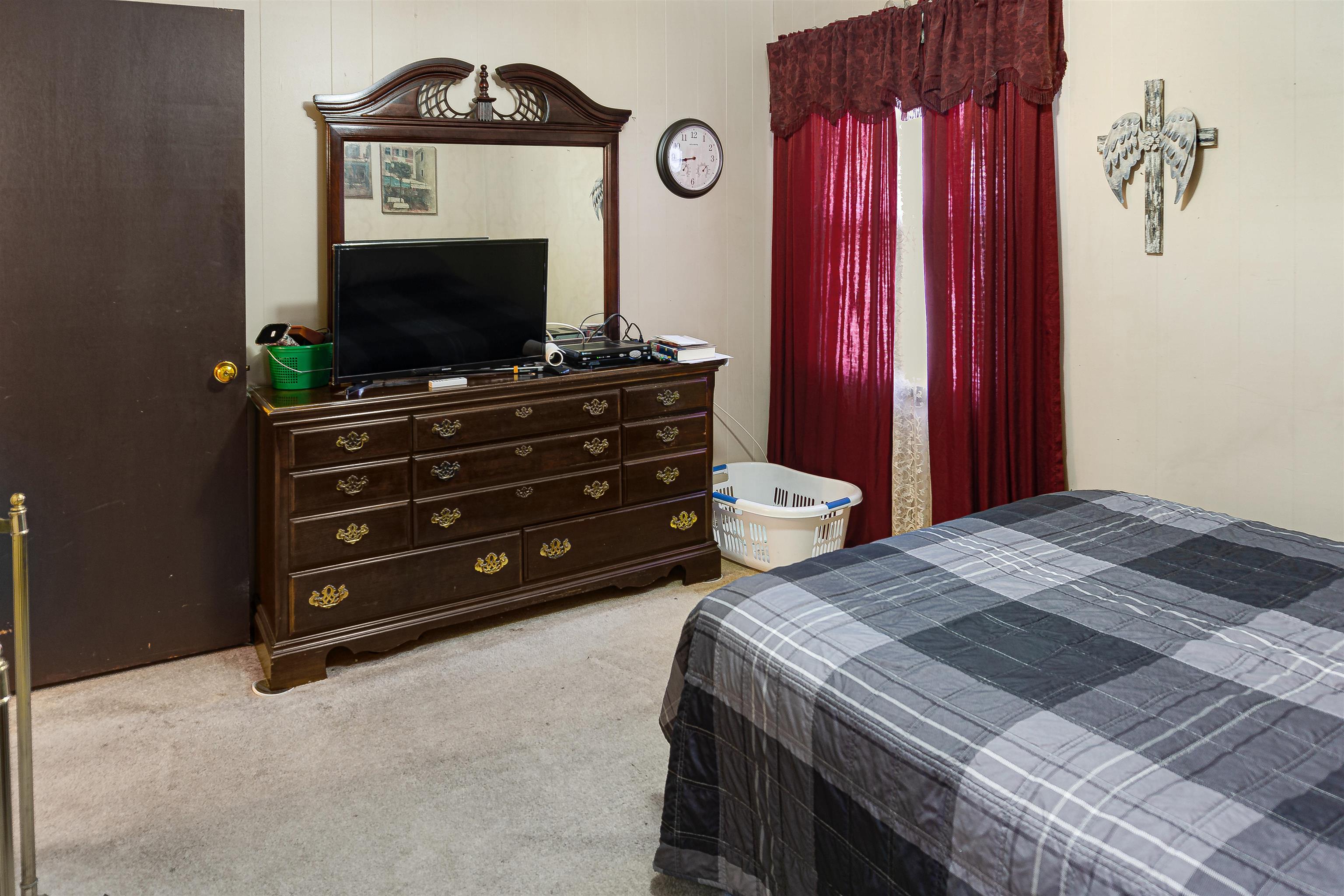 4508 Yale Road Memphis, TN 38128 - Photo 9 of 19 a bedroom with a bed and a flat screen tv