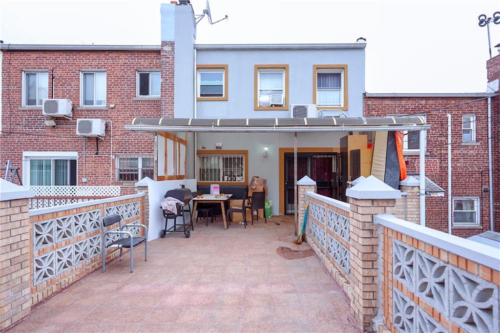 8844 18th Avenue Brooklyn, NY 11214 - Photo 3 of 19 front view of a brick house with a large windows